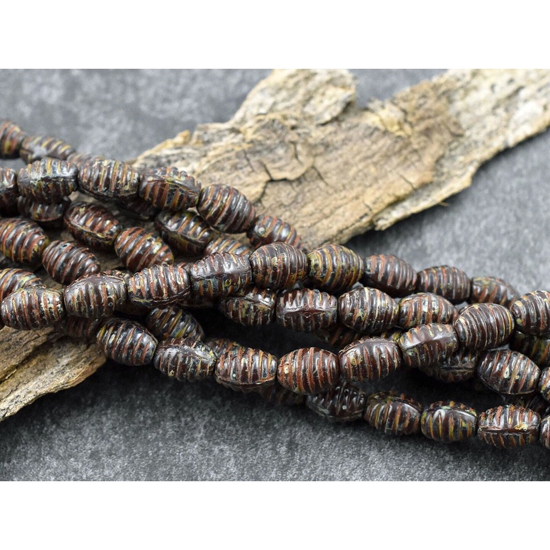 *21* 6x9mm Opaque Dark Red Travertine Grooved Oval Beads